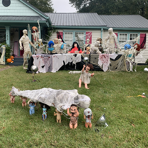 creepy dolls in a yard