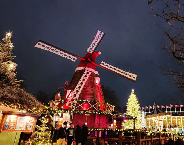 red windmill with santa hat and christmas lights