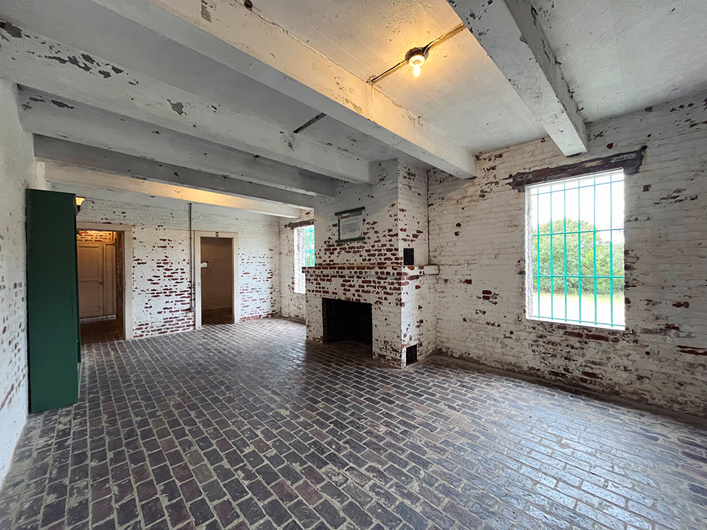 Archer's study empty with stone floors and white wood ceiling beams at Atalaya Castle