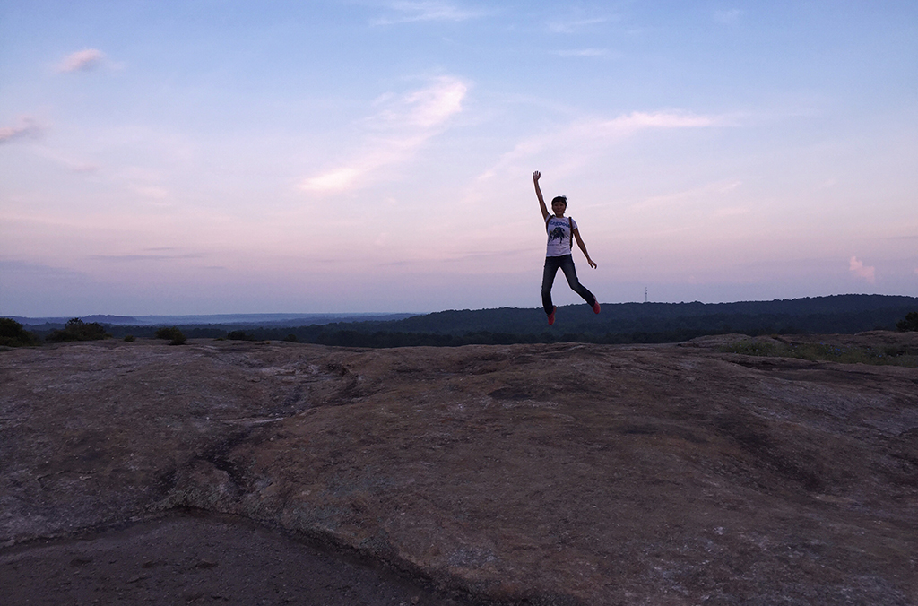 person jumping on Arabia Mountain