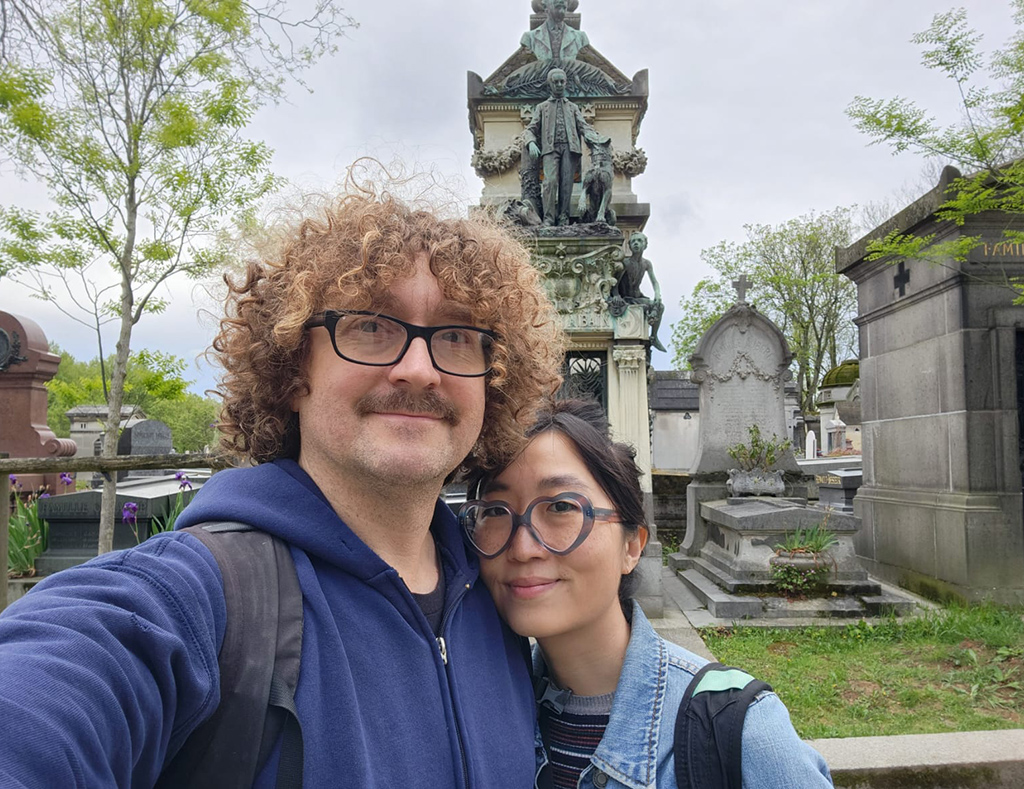 couple taking a selfie in a cemetery